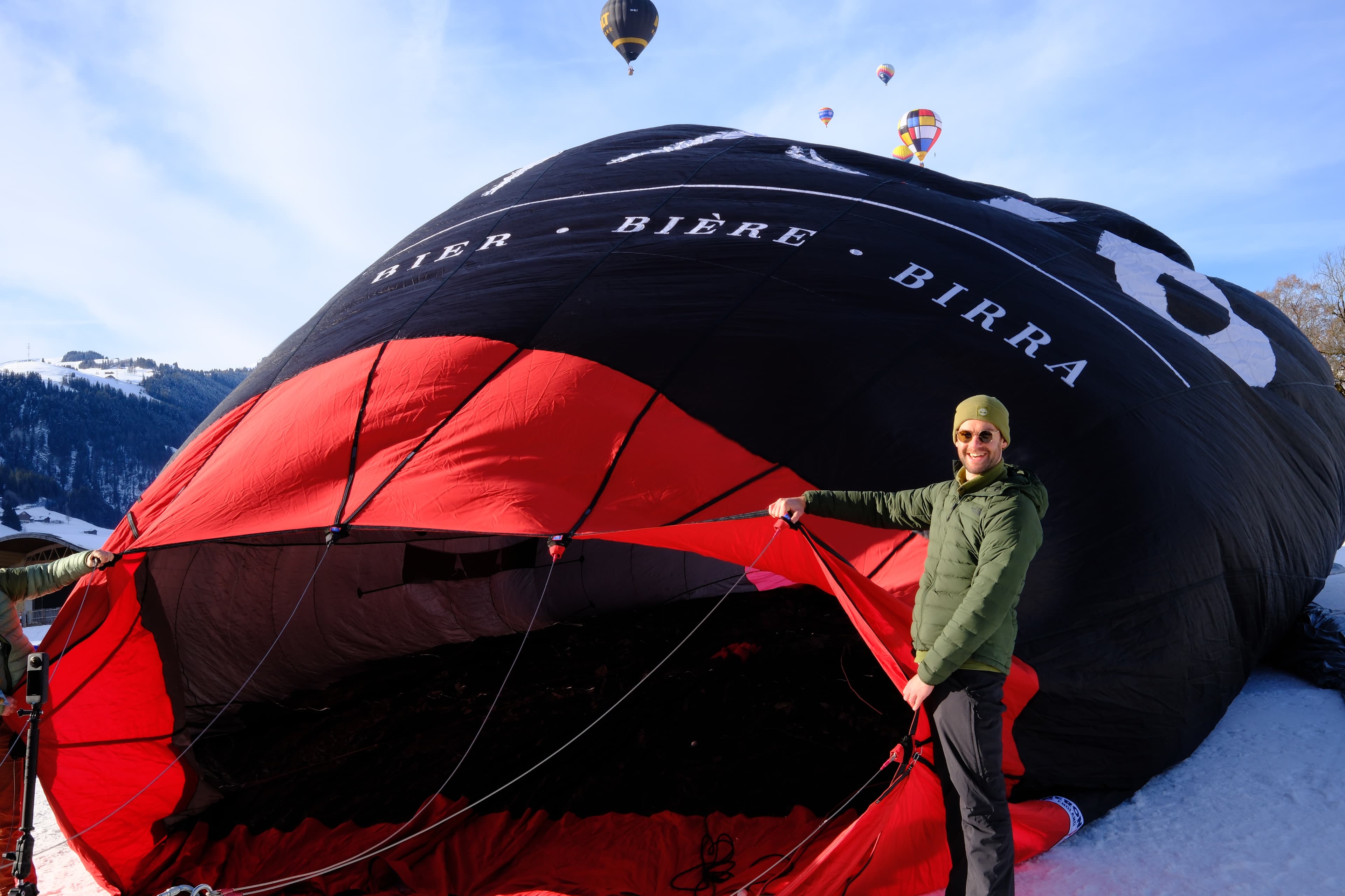 Our Co-Founder Theo helping cold inflate a balloon in Switzerland